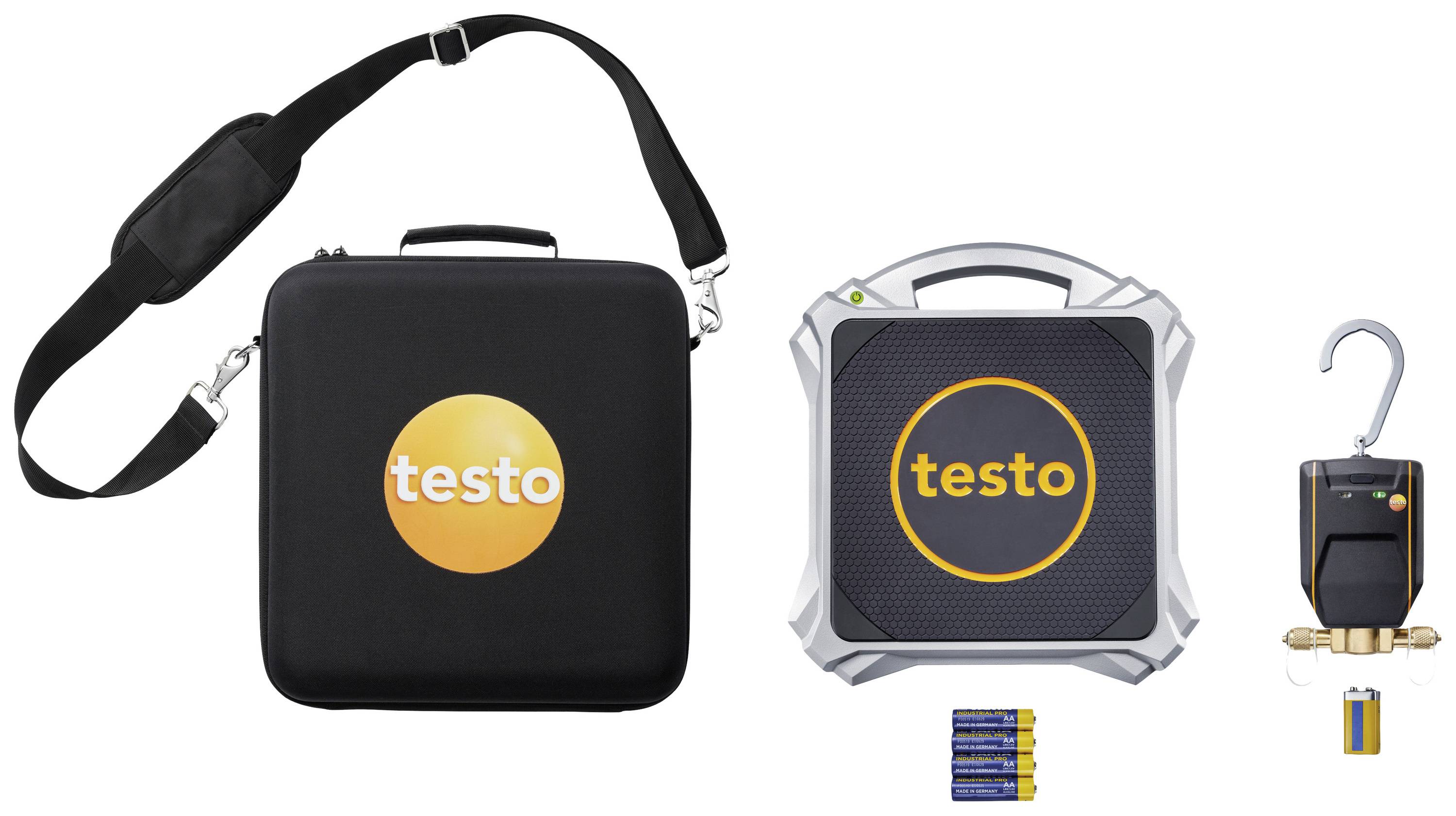 Tragetasche mit 'testo'-Logo, quadratisches Messgerät, Hakenwaage mit Rohranschluss, vier AA-Batterien und Batteriezelle.