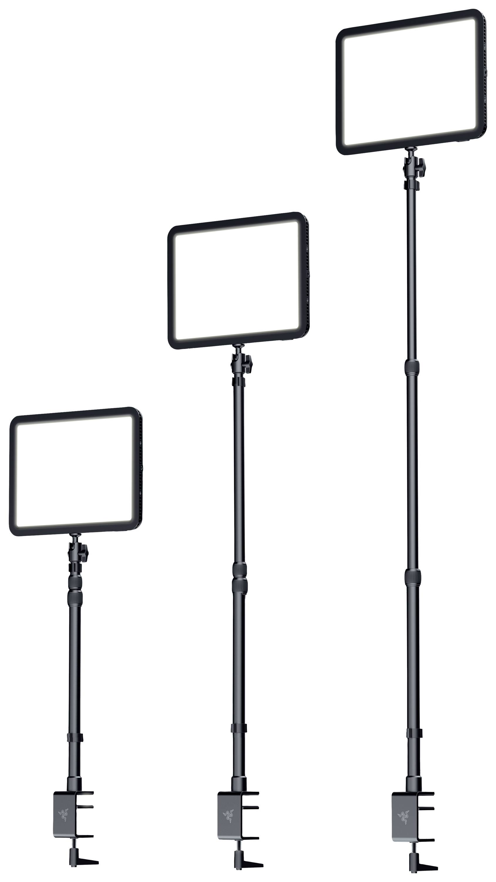 Drei verstellbare LED-Lichtpaneele in verschiedenen Höhen, montiert auf Ständern mit Klemmen zur Befestigung an Tischen.