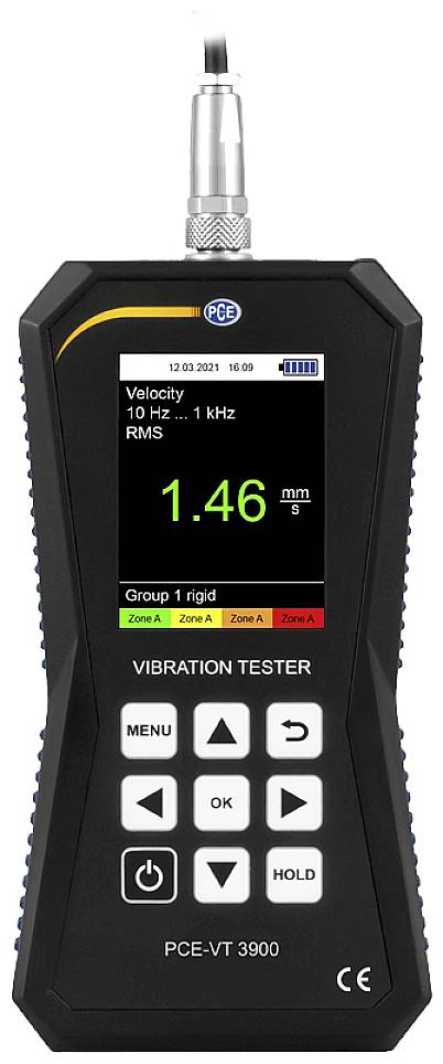Tragbares Gerät zur Schwingungsmessung mit digitalem Display. Angezeigt: 'Velocity 1.46 mm/s', Zonenklassifikation, mehrere Tasten unten.