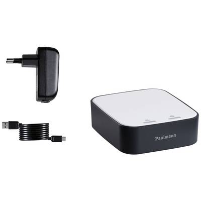 Ein weißer Adapter mit schwarzem Rand, USB-Kabel und Stecker daneben. Gerät von 'Paulmann', möglicherweise für Beleuchtung.