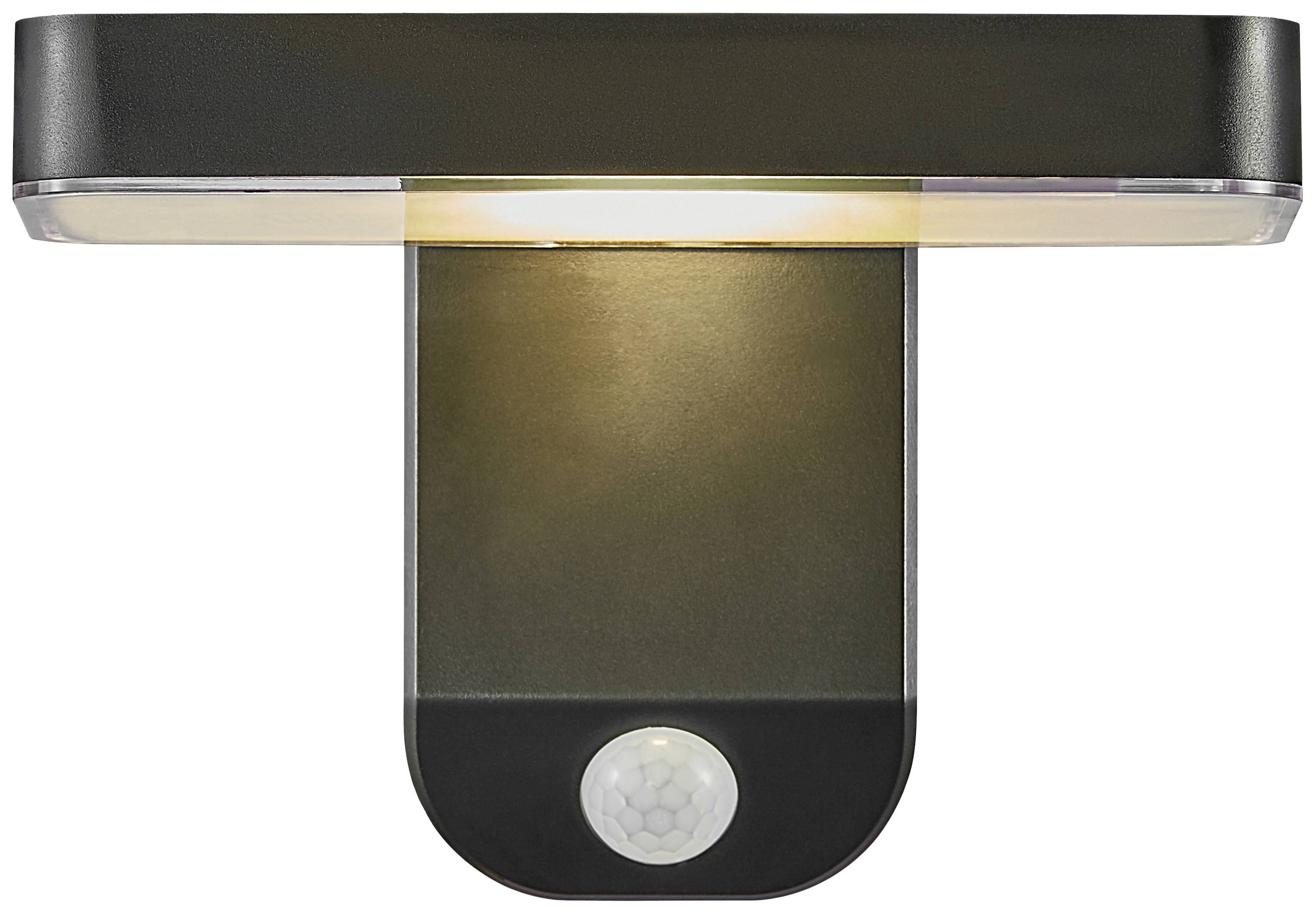 Eine schwarze Wandleuchte mit integriertem Bewegungsmelder strahlt warmes Licht aus. Ideal für den Außenbereich oder Eingänge.