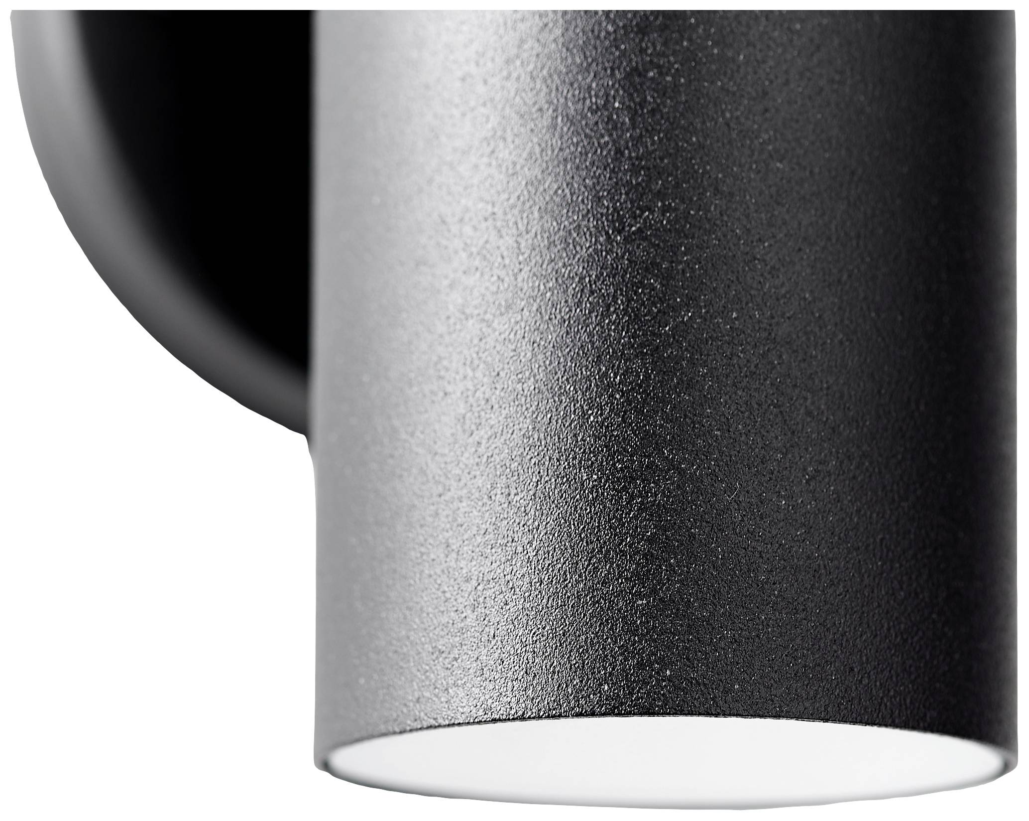 Schwarze, zylindrische Wandlampe mit strukturierter Oberfläche, von der Seite betrachtet. Sie strahlt Licht nach unten ab.