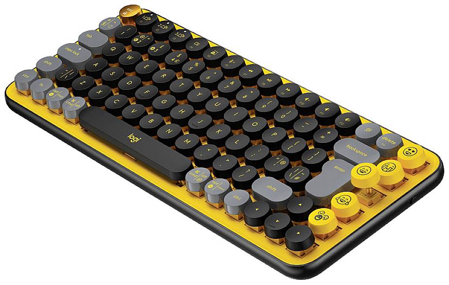 Eine kompakte mechanische Tastatur mit runden Tasten in Schwarz, Dunkelgrau und Gelb. Einige gelbe Tasten haben Emojis als Aufdruck.