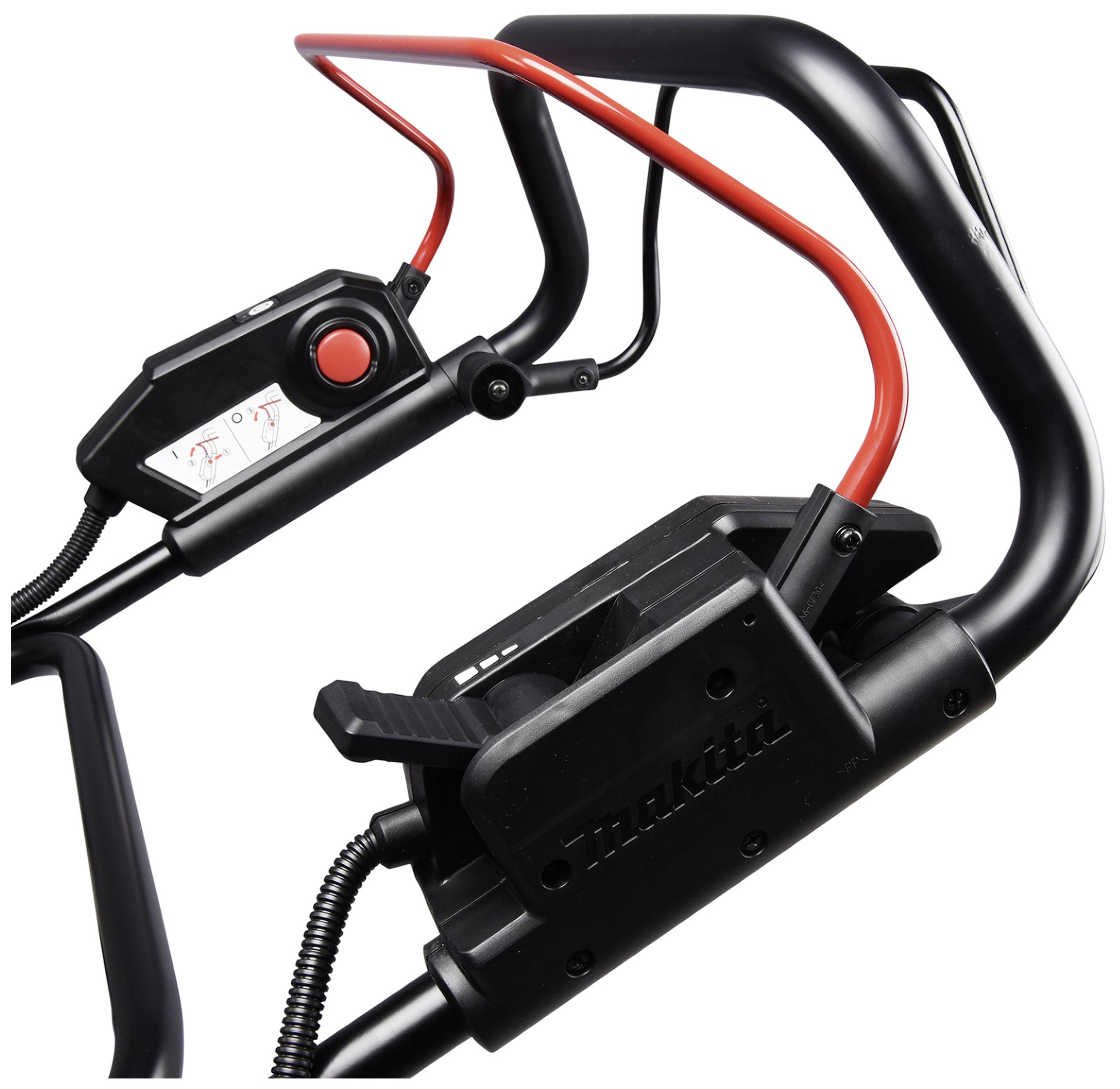 Nahaufnahme von schwarzen und roten Steuerhebeln und Schaltern eines mechanischen Geräts. Links ein großer roter Knopf und ein kleiner Hebel.