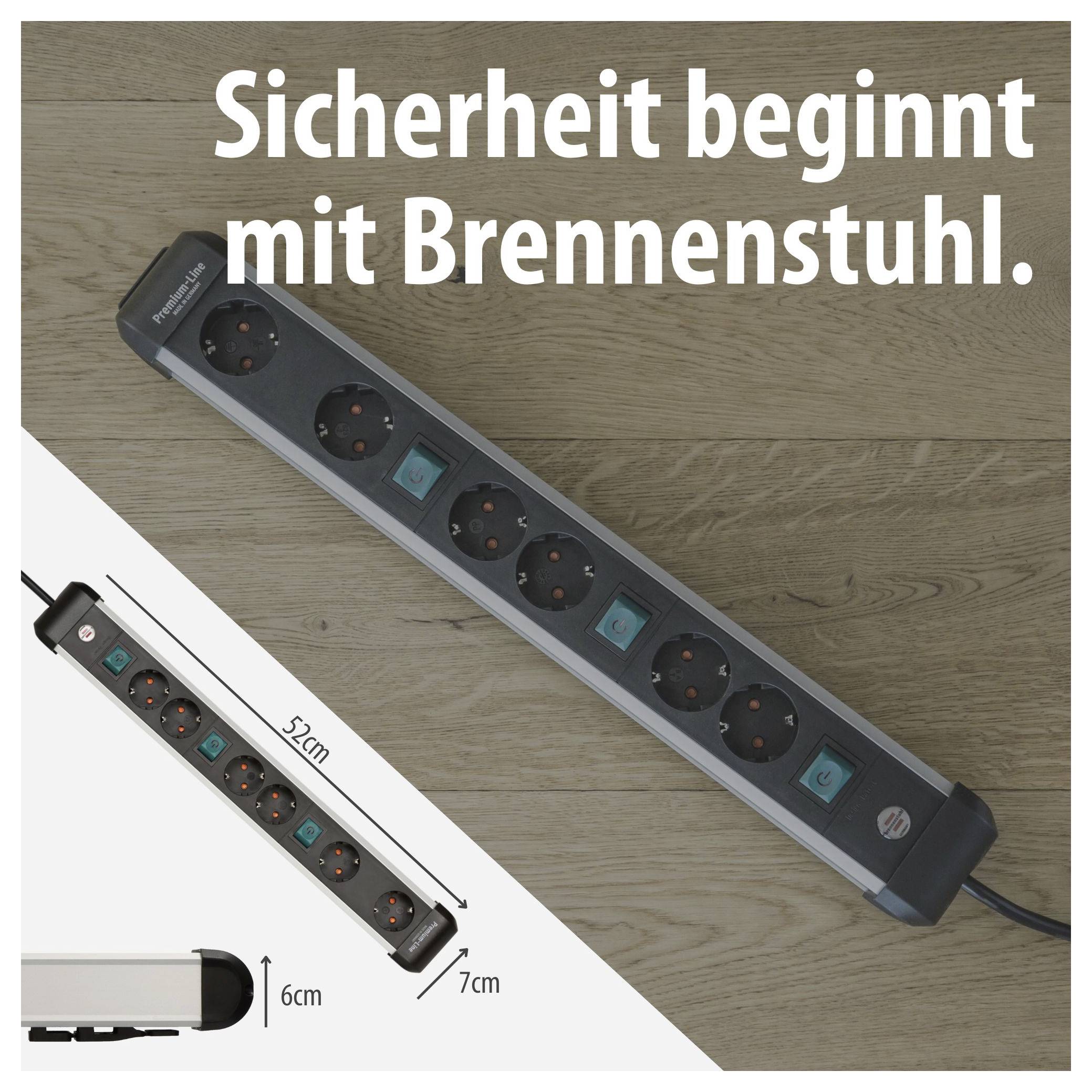 Werbeanzeige für eine Brennenstuhl-Steckdosenleiste mit dem Slogan 'Sicherheit beginnt mit Brennenstuhl.'; zeigt das Produkt auf Holzhintergrund sowie Maßangaben 52 cm, 7 cm und 6 cm.