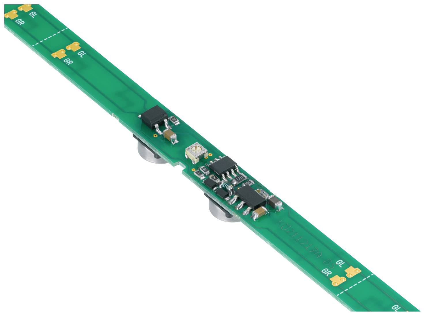 Ein langer, grüner Schaltkreis mit mehreren elektronischen Komponenten und kleinen gelben Markierungen entlang der Kanten.