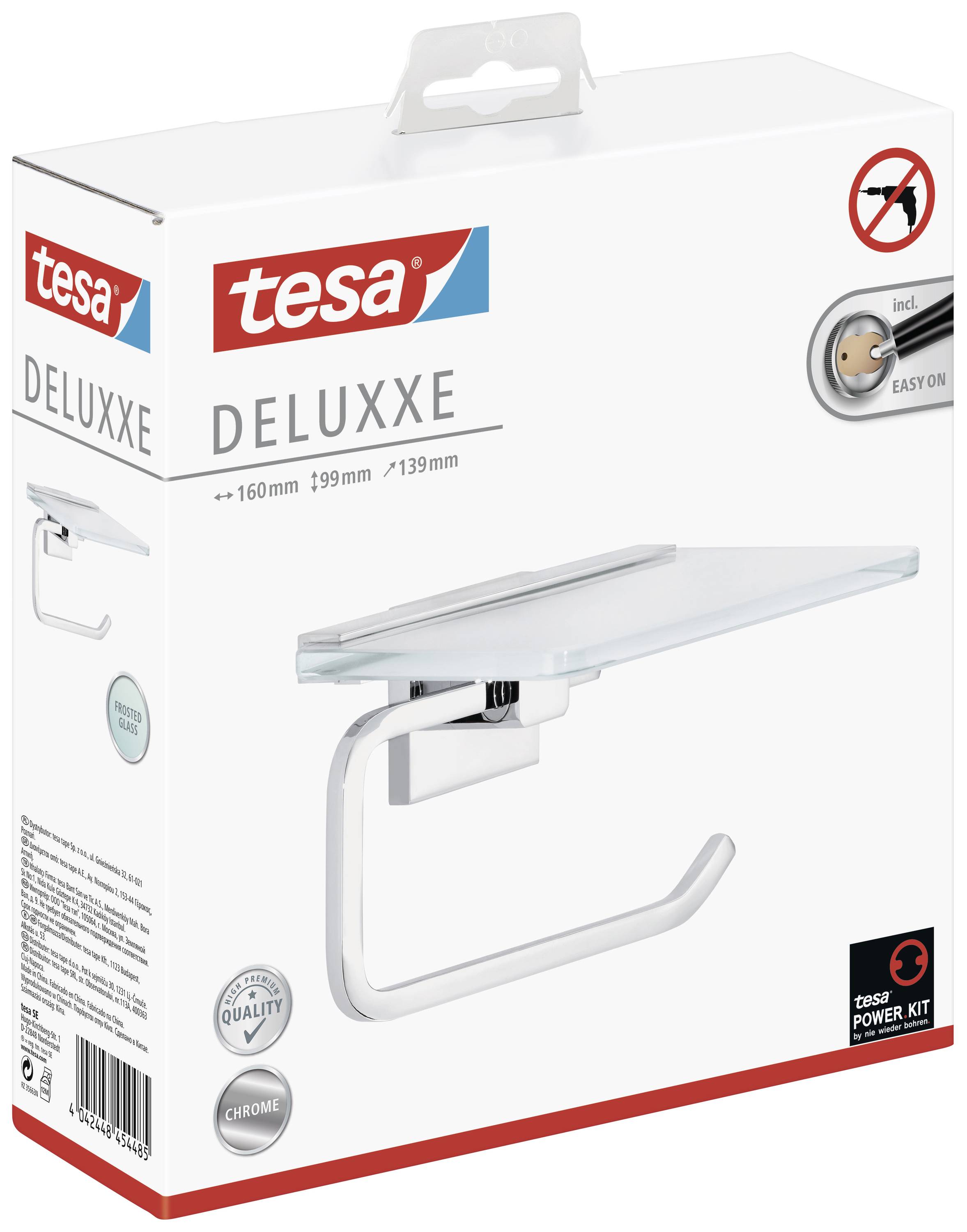 Eine Verpackung mit einem Wandpapierhalter von Tesa, Modell 'Deluxxe'. Zeigt das Produkt mit Maßen und Montagehinweisen.