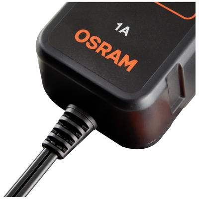 Ein schwarzes OSRAM-Ladegerät mit orangener Schrift liegt auf einer Oberfläche. Ein Kabel ist daran angeschlossen.