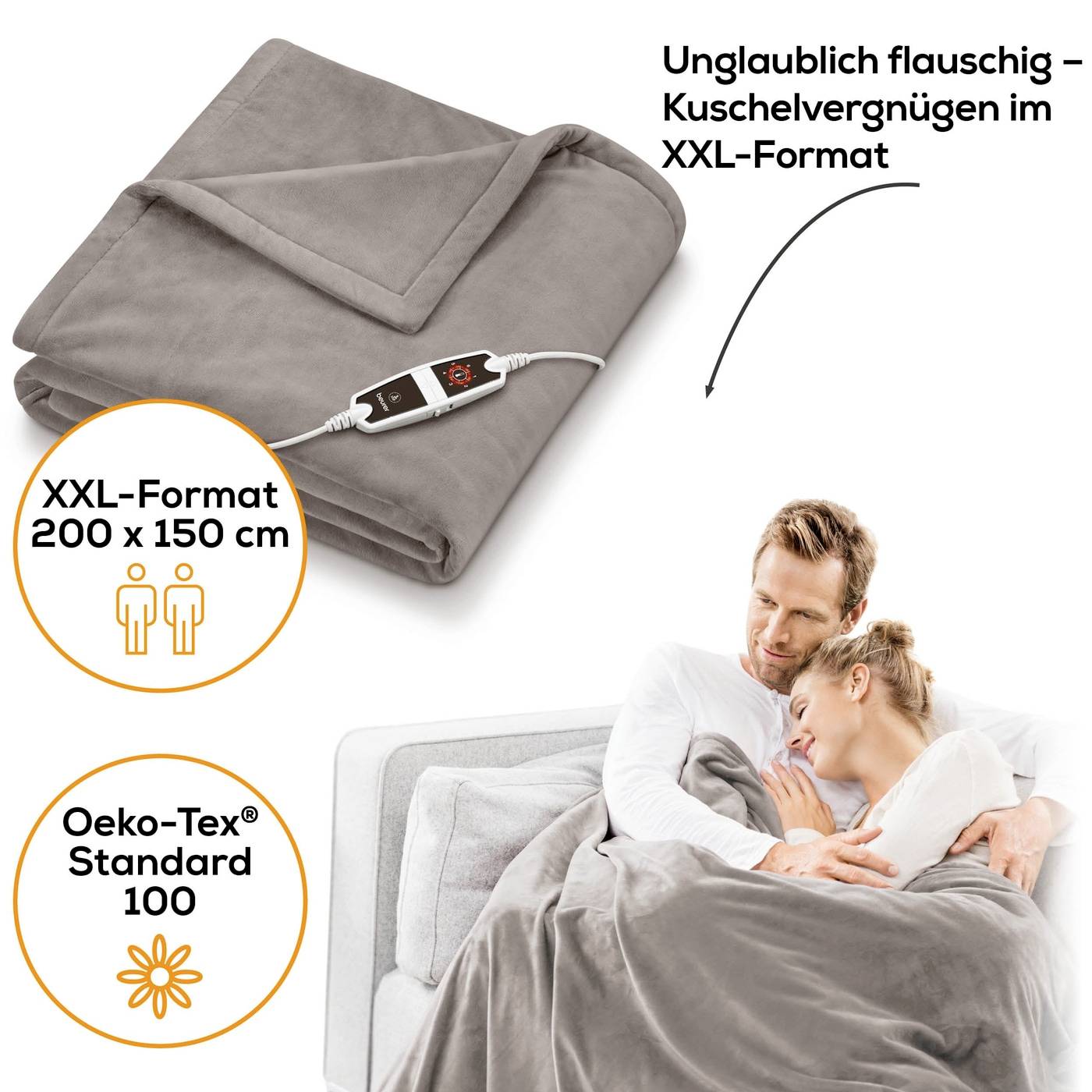 'Graue Heizdecke in XXL-Format (200 x 150 cm) mit Steuerung. Oeko-Tex Standard 100. Paar entspannt unter der Decke auf einer Couch.'