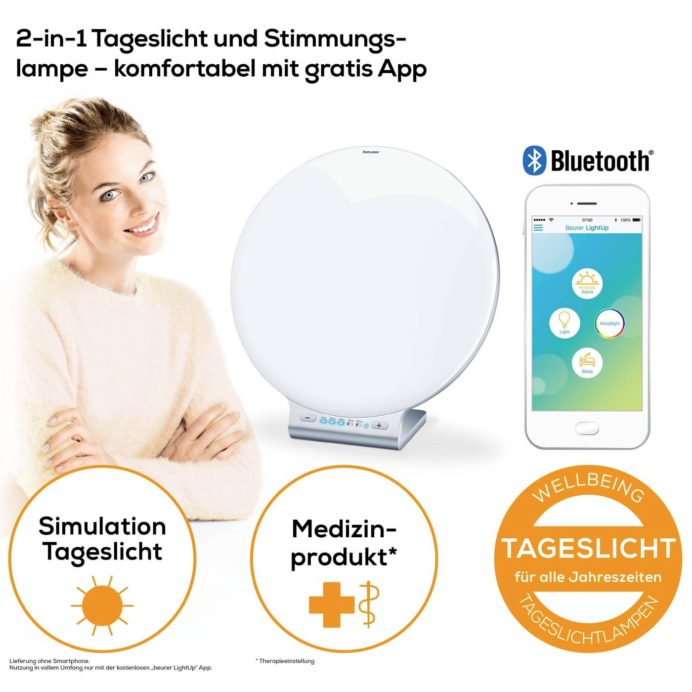 'Frau neben einer runden Tageslichtlampe und Smartphone mit App. Text: 2-in-1 Tageslicht- und Stimmungs-Lampe, komfortabel mit gratis App, Bluetooth.'