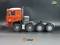 Roter Modell-LKW mit sechs großen Reifen auf einem schwarzen Hintergrund, präsentiert von Thicon Models und Scale Club.