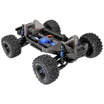 Ferngesteuertes Auto-Chassis ohne Karosserie, große Geländereifen, sichtbare Elektronikkomponenten und stoßdämpfende Aufhängung.