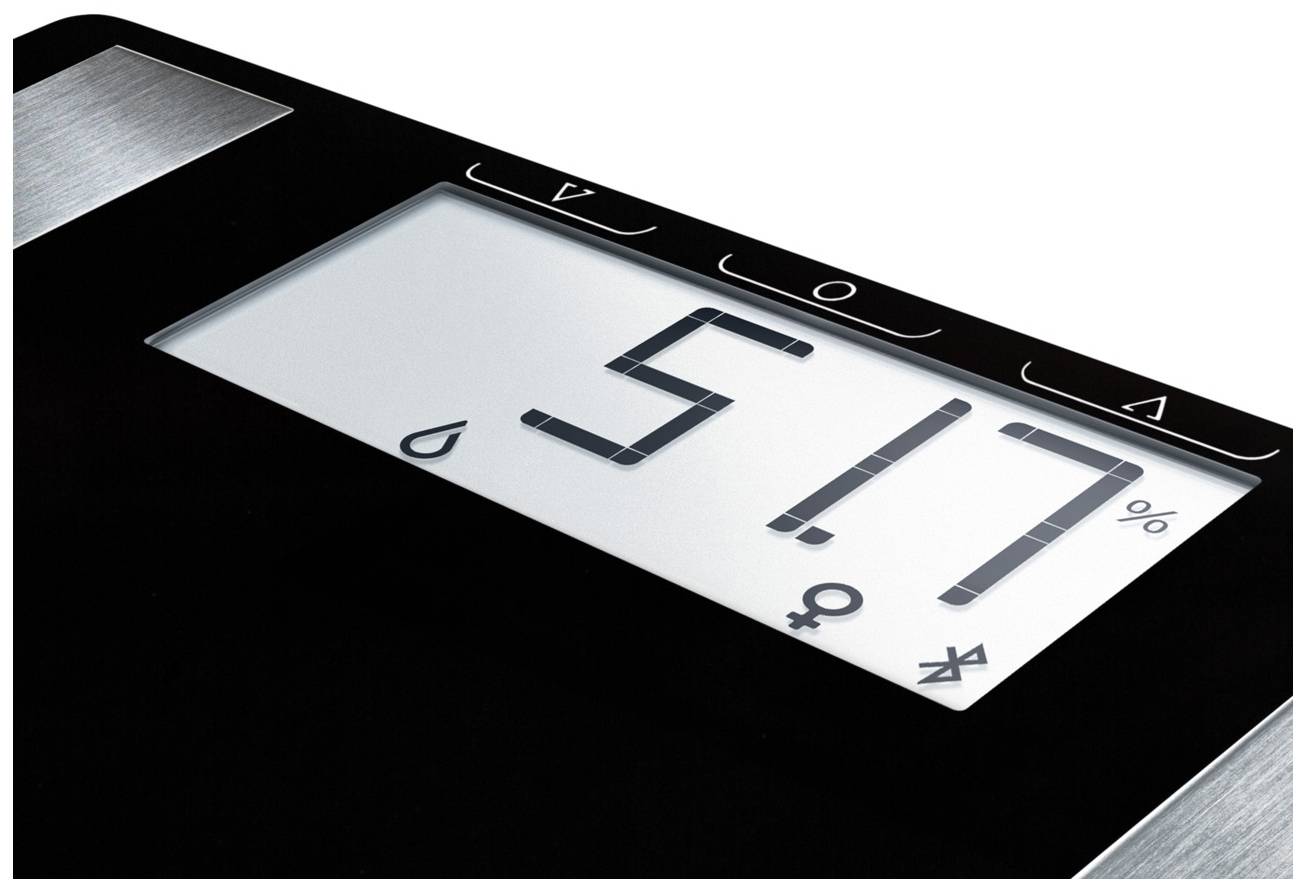 Anzeige einer Waage mit der Zahl '5,17 %'. Symbole für Flüssigkeitstropfen und Geschlechtssymbole sichtbar.