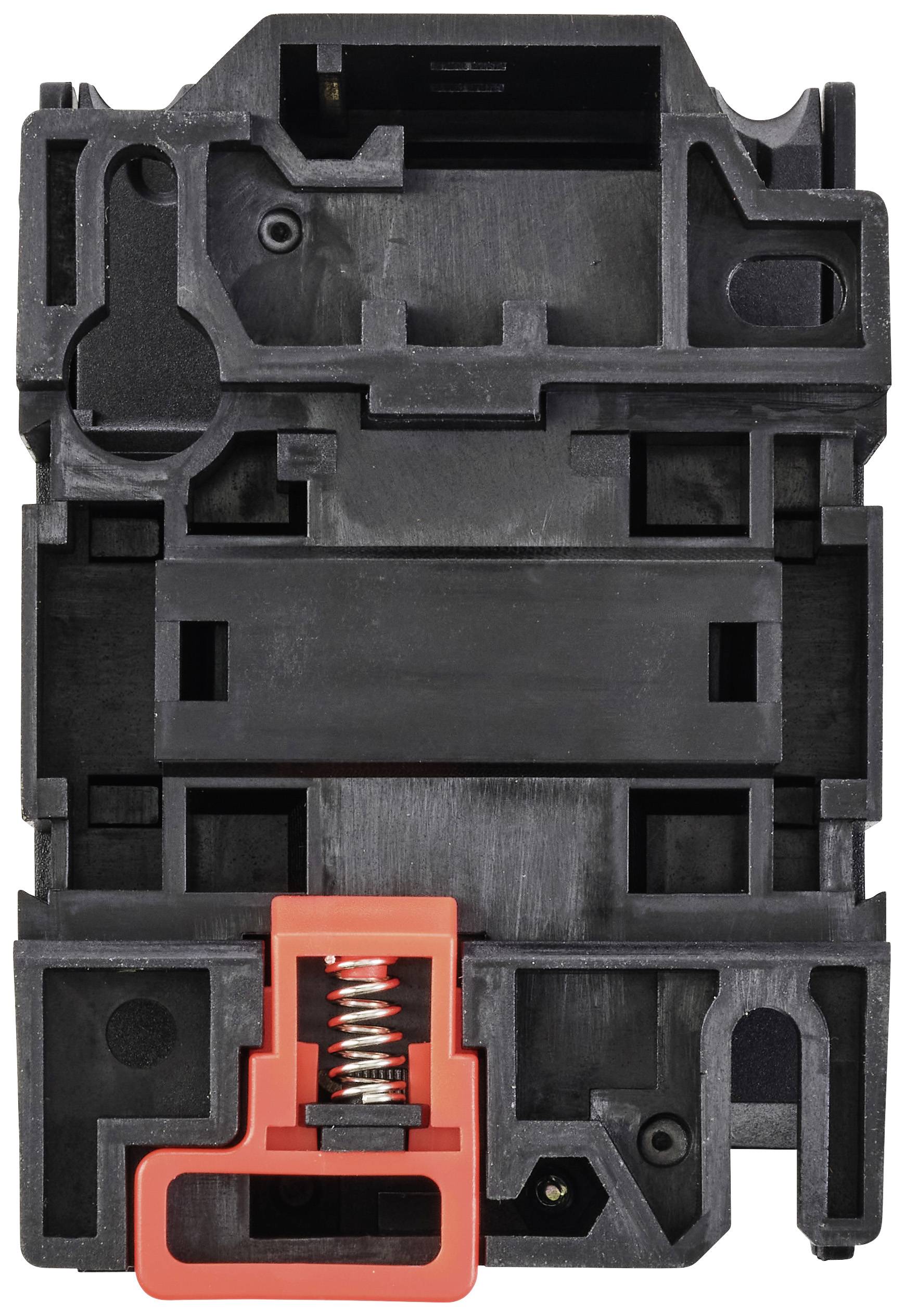 Ein schwarzes Kunststoffteil mit komplizierter Struktur; unten ist ein roter, federbelasteter Mechanismus sicht.