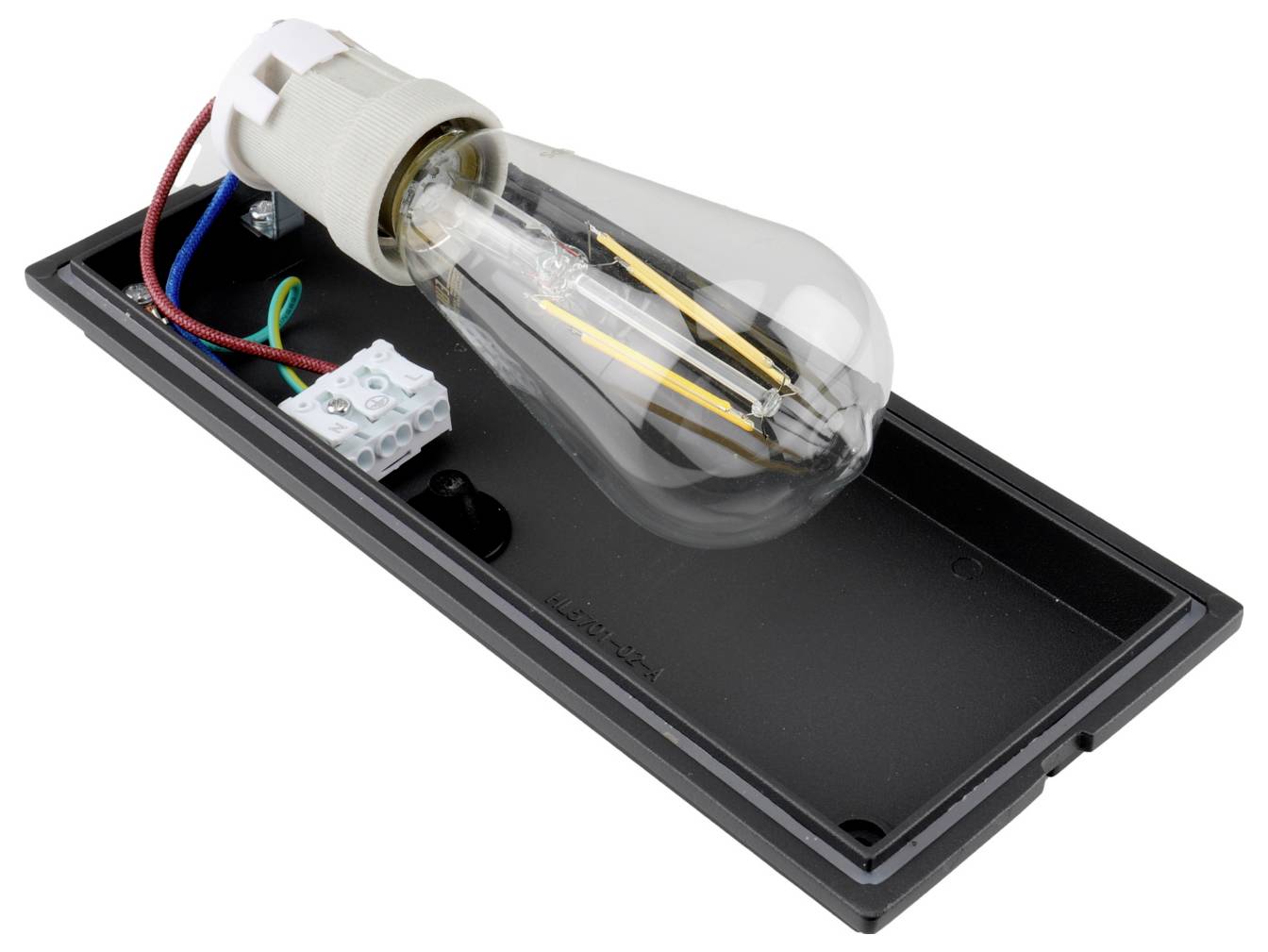 LED-Filamentlampe, montiert in einem schwarzen rechteckigen Lampenfuß mit sichtbaren Kabeln und Fassungskomponenten.