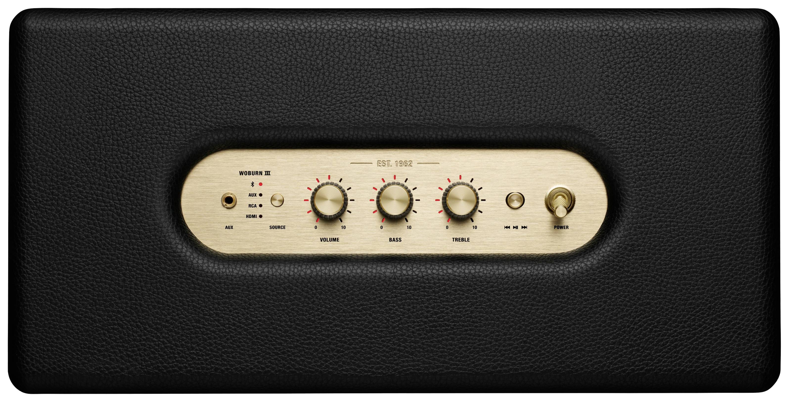 Schwarzer Audio-Lautsprecher mit goldenem Bedienfeld. Drei Drehknöpfe zur Steuerung von Volume, Bass und Treble. Ein- und Ausschalter rechts.