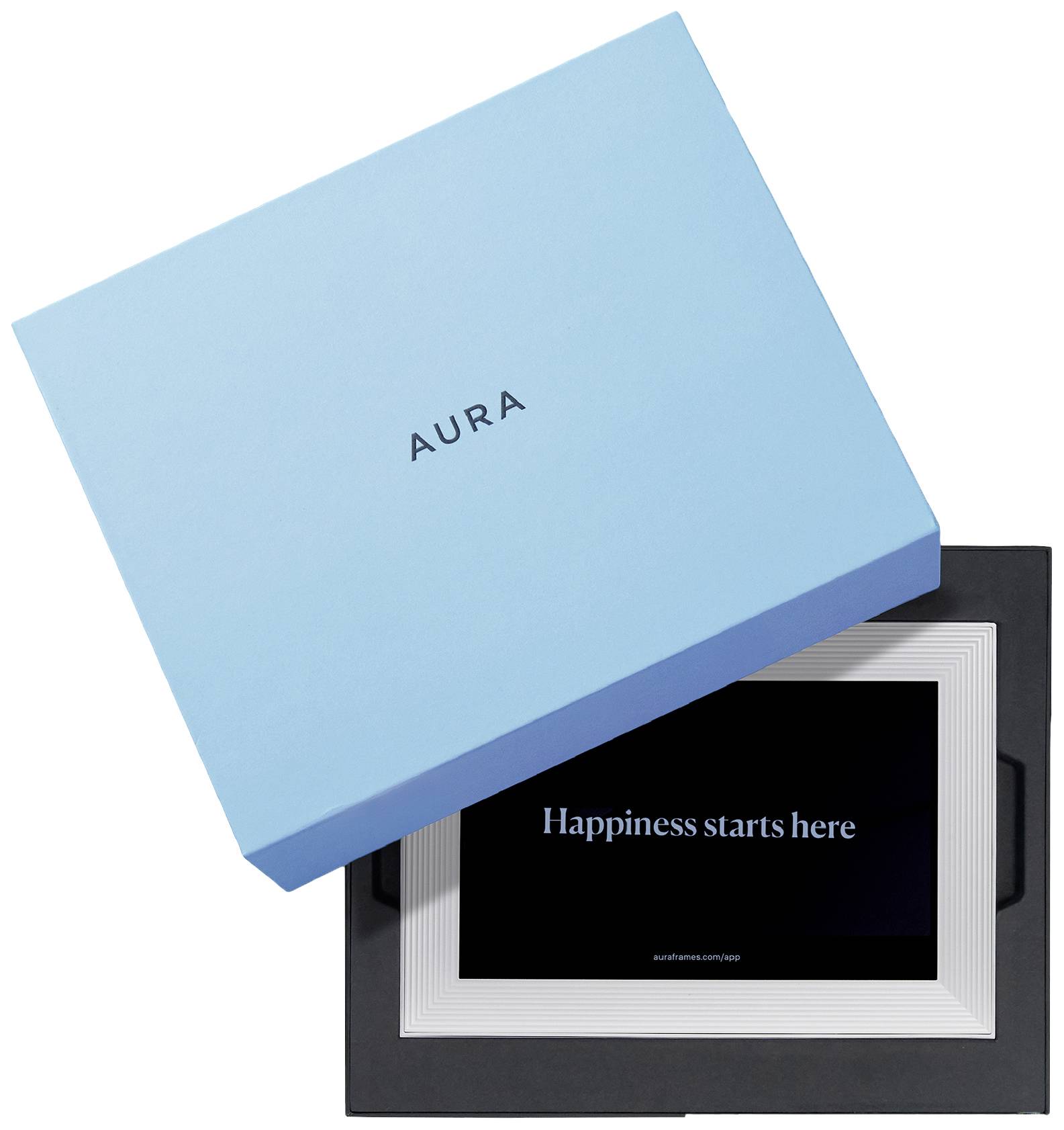Eine blaue Box mit der Aufschrift 'AURA' liegt schräg auf einem digitalen Bilderrahmen, der den Text 'Happiness starts here' anzeigt.