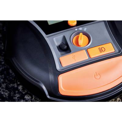 Ein Nahaufnahme eines elektronischen Bedienfelds mit orangefarbenen Tasten und einem Drehschalter, möglicherweise Teil eines Geräts.