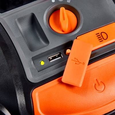 'Nahaufnahme einer orangefarbenen Schalterleiste mit einem Schieberegler, einem USB-Anschluss und einem Hauptschalter auf einem Gerät.'