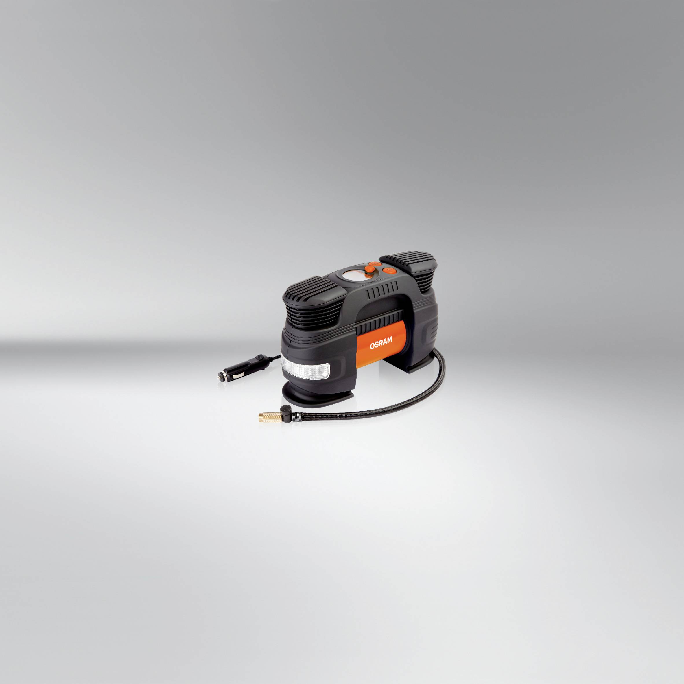 Ein tragbarer Reifenkompressor mit Kabel und Schlauch, geeignet für das Aufpumpen von Reifen. Kompakte, schwarze Bauweise.