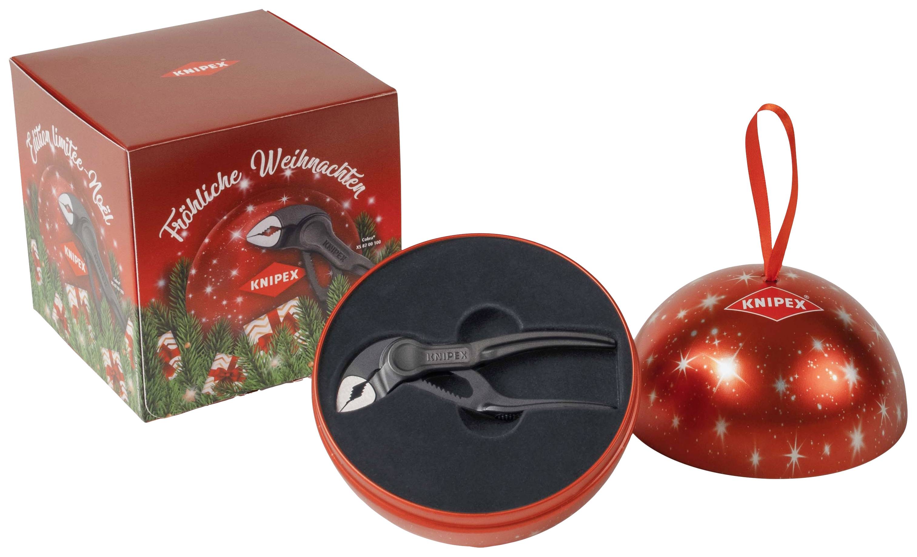 Rohrzange als Weihnachtsgeschenk in roter Kugelverpackung mit 'Frohe Weihnachten' und Weihnachtsmotiv auf der Packung.