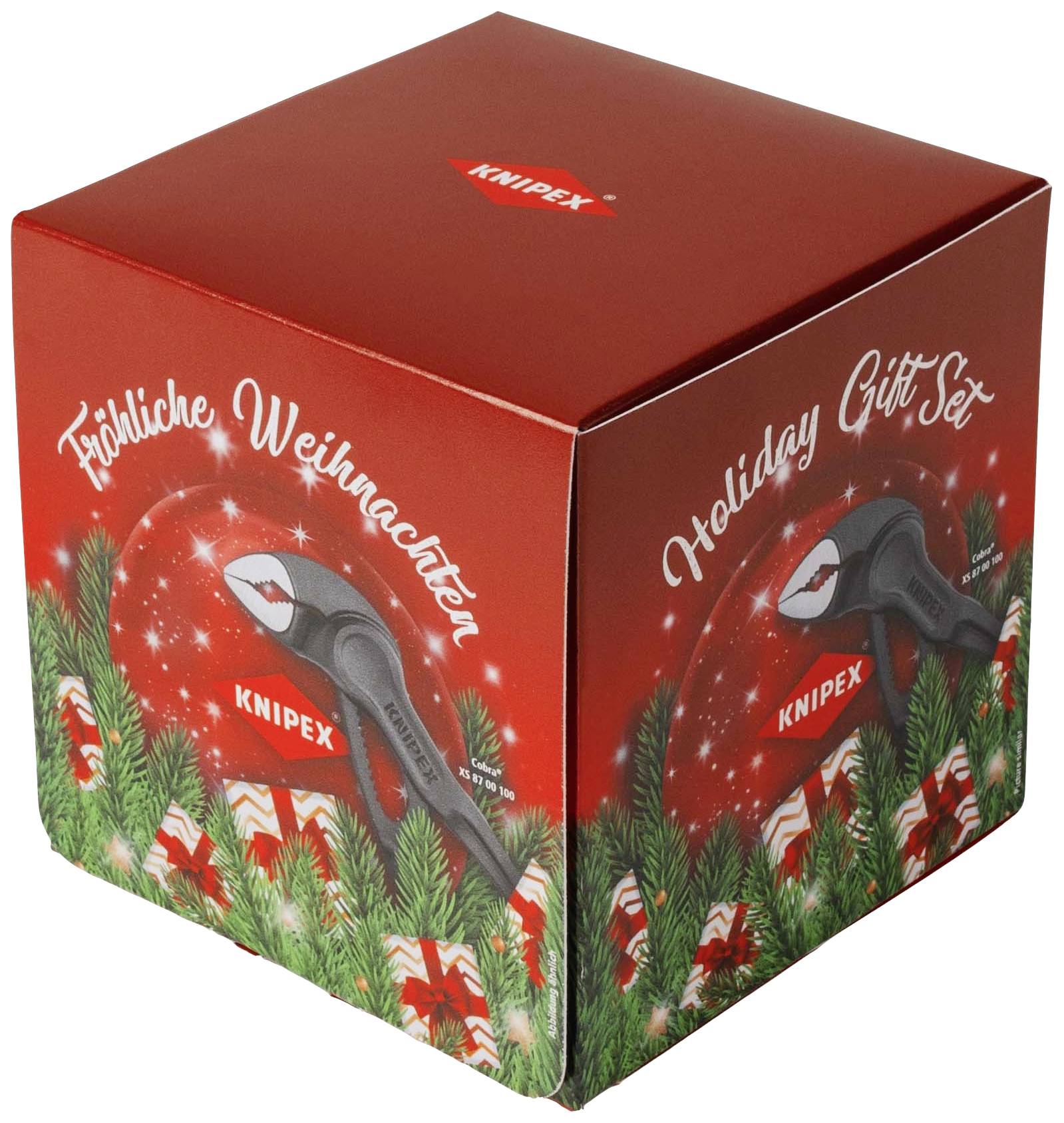 Rote Geschenkschachtel mit der Aufschrift 'Fröhliche Weihnachten' und 'Holiday Gift Set'. Zeigt ein Werkzeug, umgeben von Tannen und Geschenken.