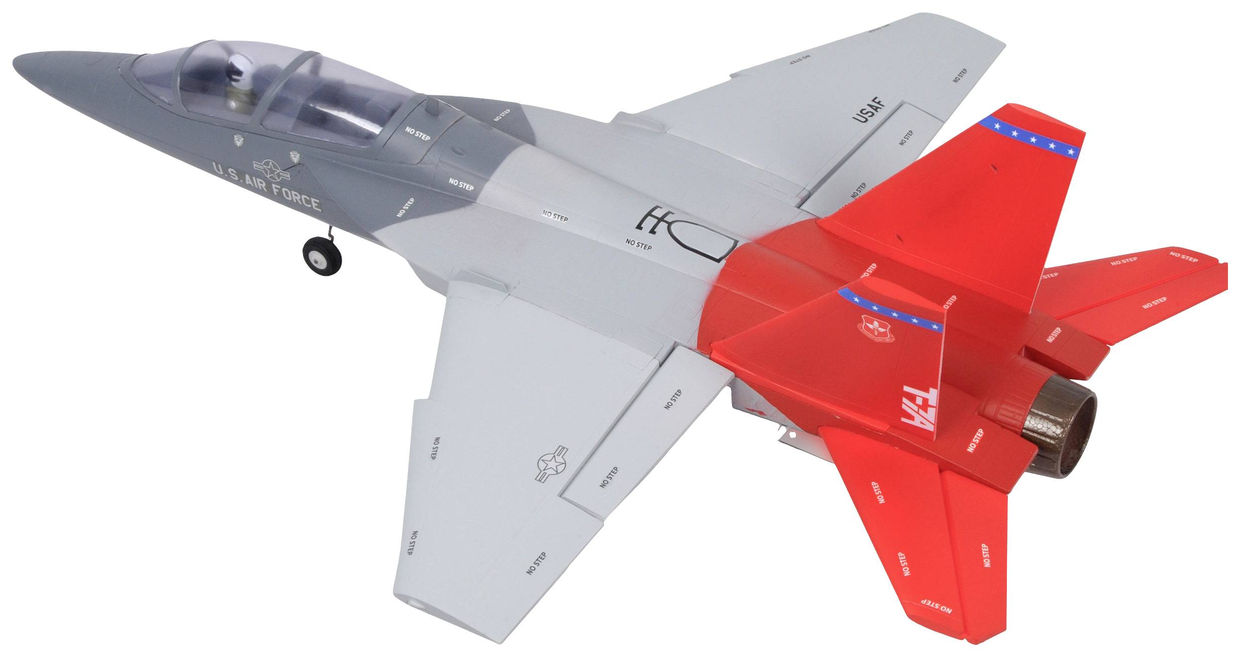 Ein graues Spielzeugflugzeug mit auffälligen roten Flügeln hinten, repräsentiert ein Kampfflugzeug der U.S. Air Force.