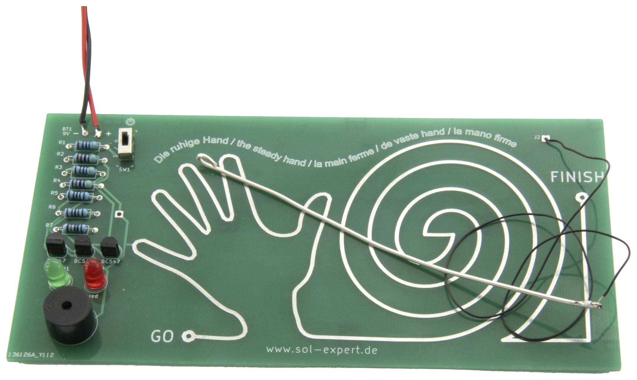 Elektronisches Geschicklichkeitsspiel mit Drahtlabyrinth auf grüner Platine. Hauptziel: Draht berührungslos durch Spirale führen.