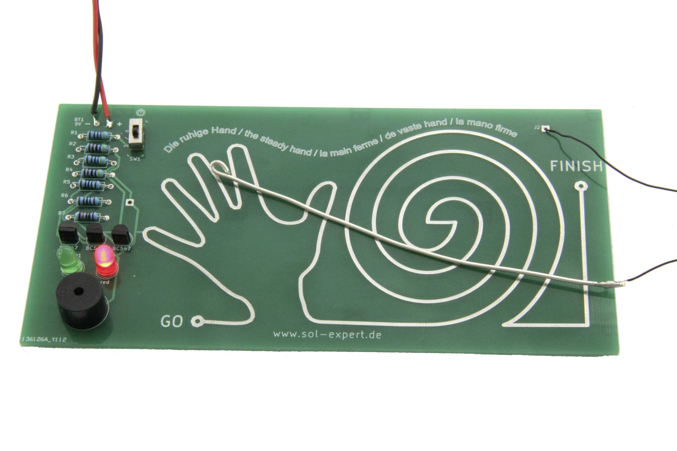 Ein Geschicklichkeitsspielbrett mit Drahtlabyrinth. Ziel ist es, den Draht mit einer Schleife vom 'GO' zum 'FINISH' zu führen, ohne ihn zu berühren.