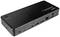 Eine schwarz glänzende Laptop-Dockingstation mit mehreren Anschlüssen, darunter HDMI, USB und Ethernet, zur Erweiterung von Anschlussmöglichkeiten.