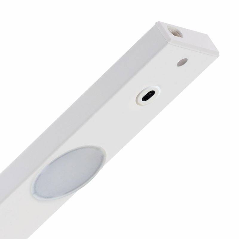 Ein weißer, rechteckiger Bewegungsmelder mit kreisförmigem Sensor und kleiner Linse auf der Vorderseite, zum Erkennen von Bewegung.