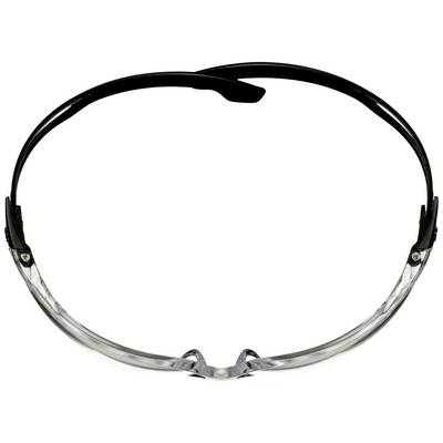 Transparente Schutzbrille mit schwarzem Rahmen, von oben fotografiert.