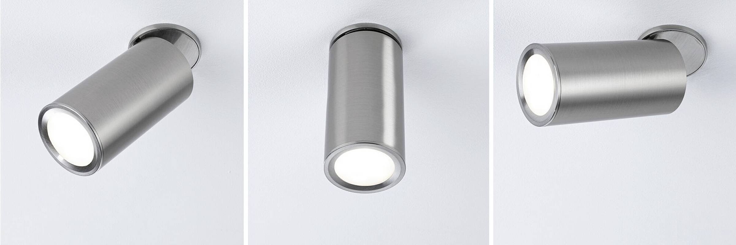 Drei moderne, zylindrische Deckenstrahler aus Metall, jeweils in verschiedenen Positionen montiert und beleuchtet.