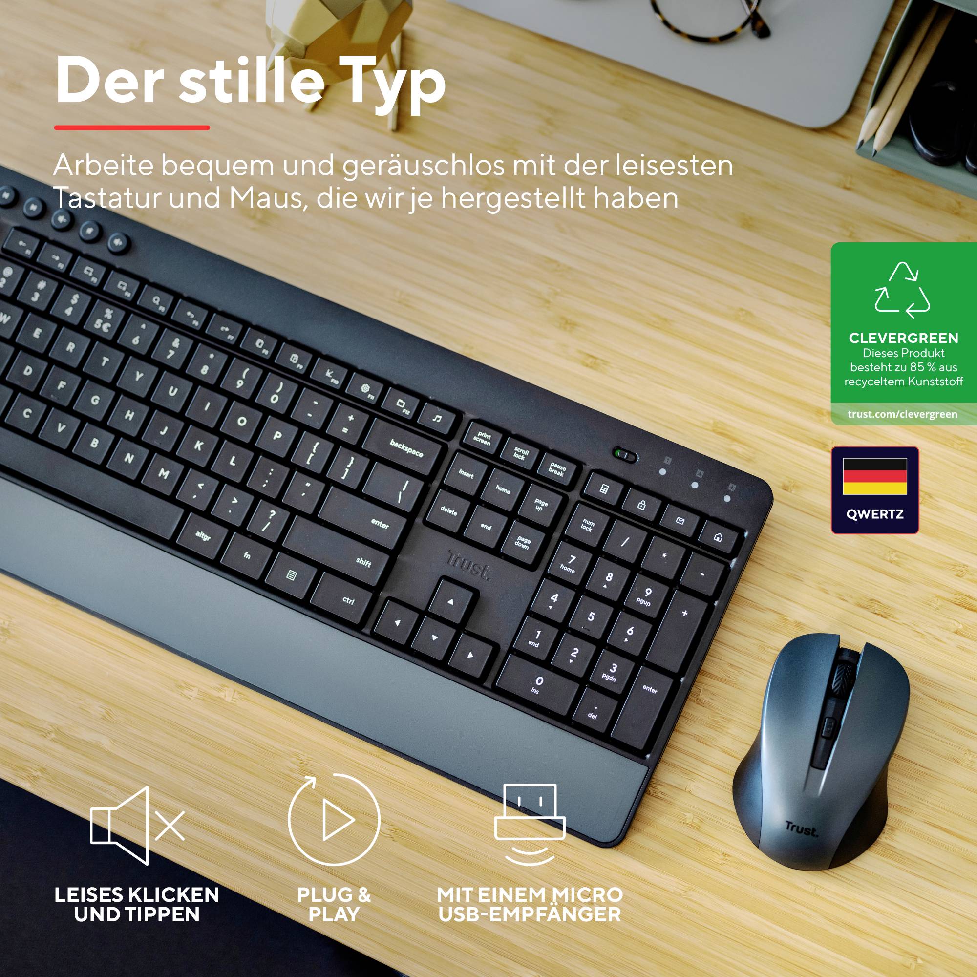 Eine leise kabellose Tastatur und Maus auf einem Schreibtisch mit dem Text 'Der stille Typ'. Produktbeschreibung in Deutsch.