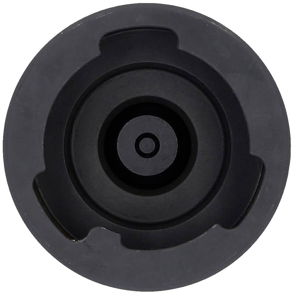 Ein schwarzer runder Deckel mit mehreren konzentrischen Kreisen.