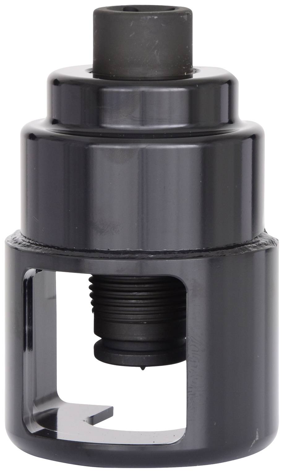 Ein schwarzes, zylinderförmiges Werkzeug, möglicherweise ein Ausdrücker oder Adapter, mit einem Hohlraum und Gewinde in der Mitte.