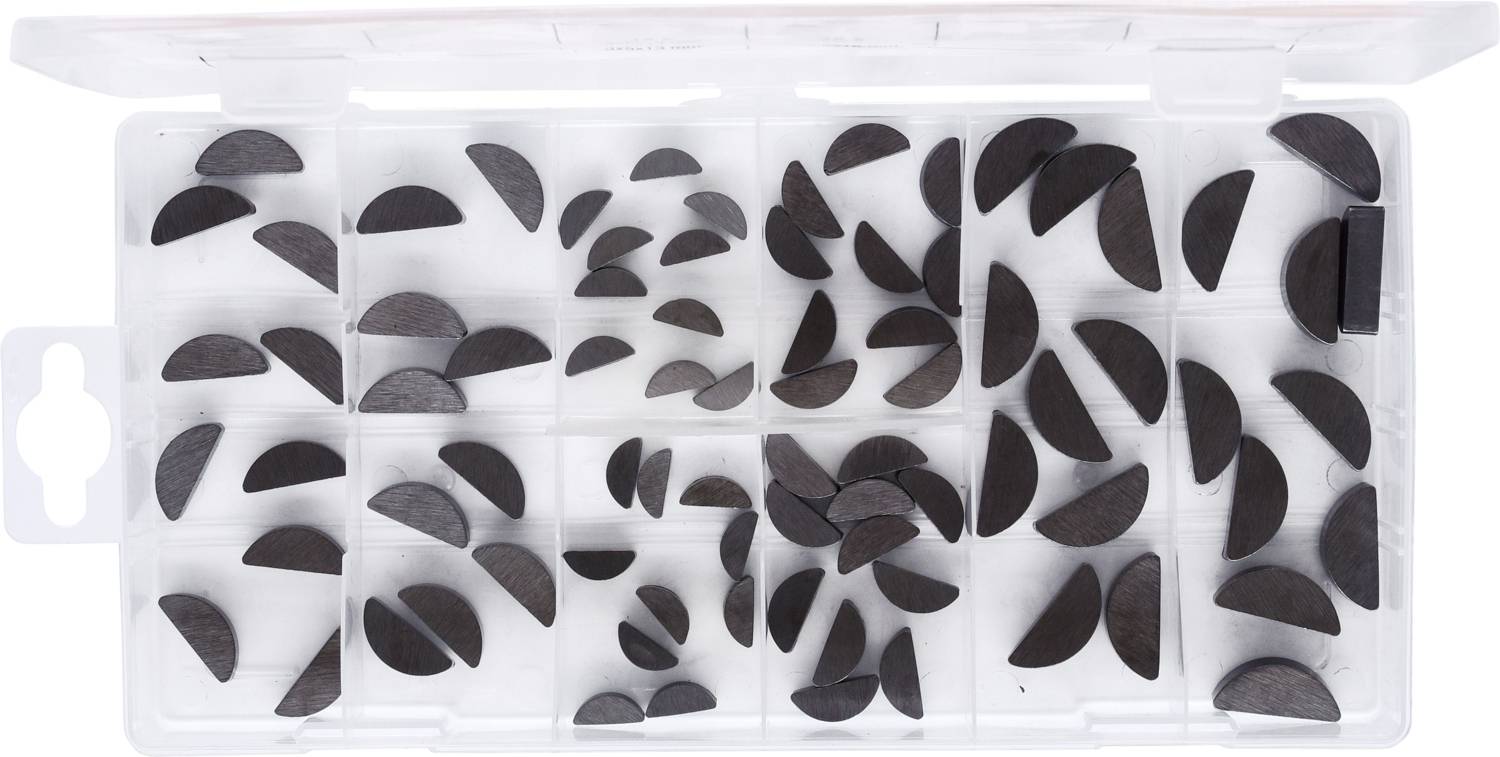 Eine transparente Box mit mehreren Fächern, die kleine, halbrunde schwarze Metallteile enthält.