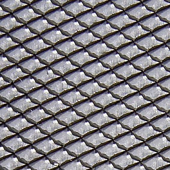 Reptilienhaut mit gleichmäßig angeordneten, schuppenartigen Strukturen.