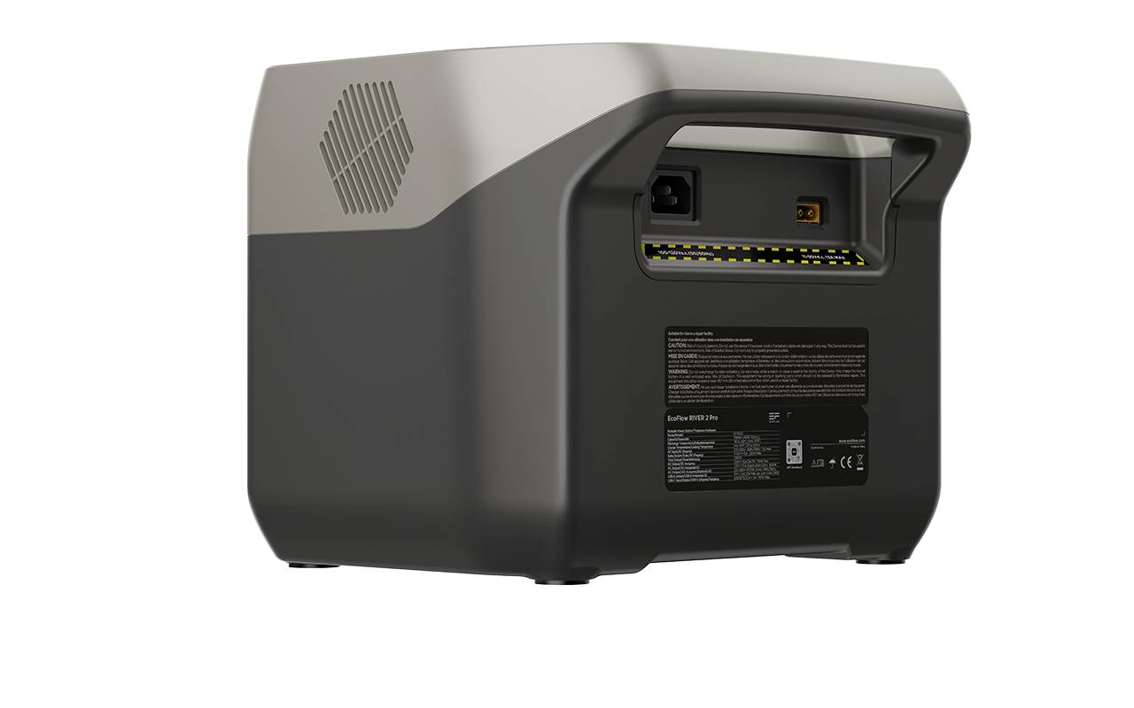 Tragbare Powerstation in Schwarz mit silbernem Griff, Lüftungsschlitzen und mehreren Anschlüssen auf der Rückseite.