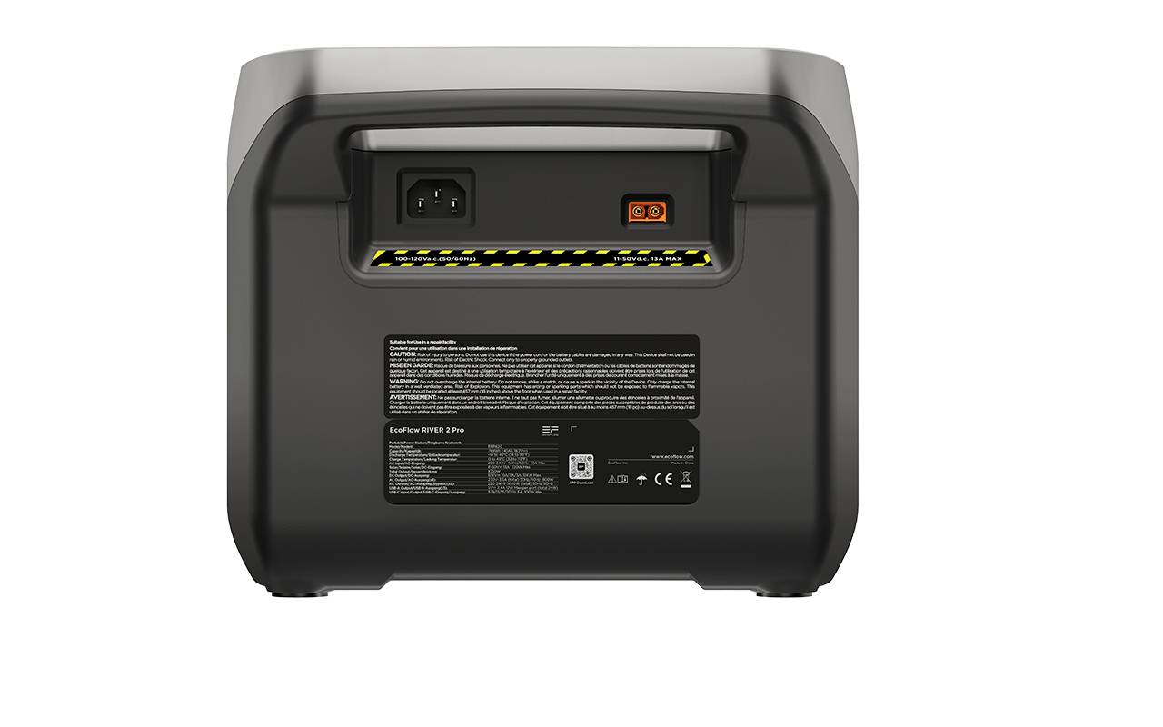 Schwarzes Elektrogerät mit Schalter und Anschluss auf der Rückseite, umgeben von Warnhinweisen.