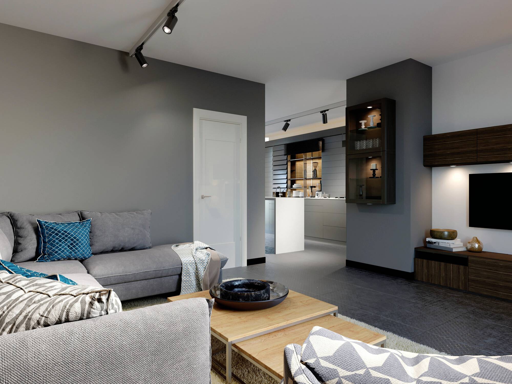 Wohnzimmer mit grauem Sofa, Holztisch und modernem TV-Schrank; im Hintergrund ist eine offene Küche sichtbar.