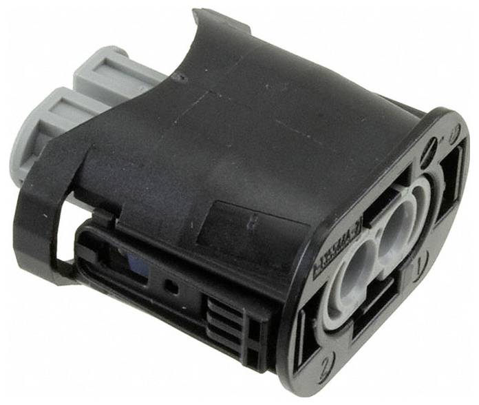 Eine Nahaufnahme eines schwarzen Elektrosteckers mit zwei kreisförmigen Anschlüssen, der für die Automobilverkabelung verwendet wird.