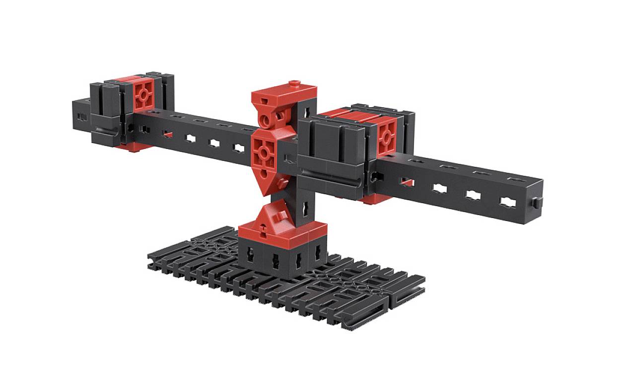 Ein schwarzes und rotes technisches Baukastensystem, das ein stabilisierendes Gerüst mit zwei langen Armen auf einer Basis bildet.