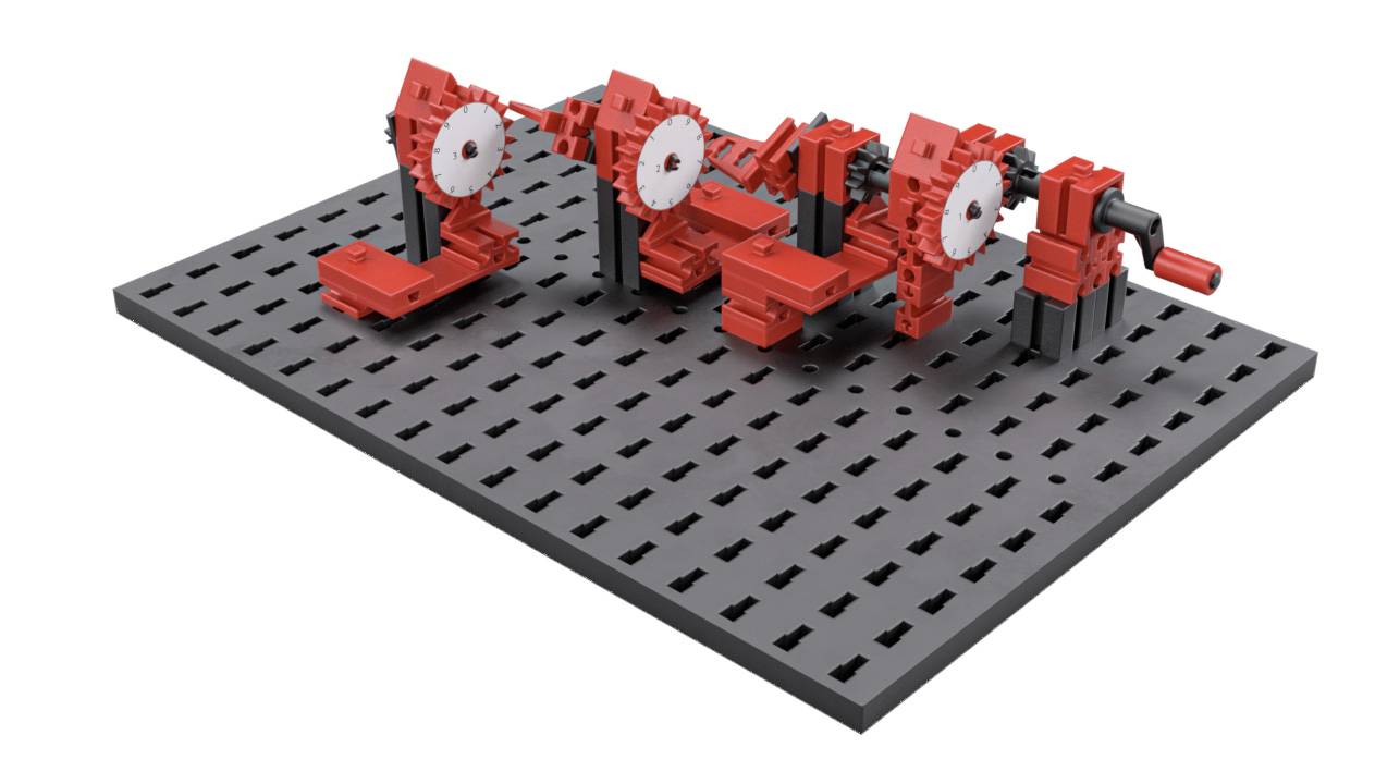 Lego-Modell eines Maschinenteils mit roten Zahnrädern auf schwarzer Grundplatte.