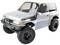 Silbernes Modellauto eines SUVs mit großen Geländereifen, bulligem Design und schwarzen Fensterrahmen.