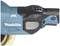 Nahaufnahme eines blauen Makita-Elektrowerkzeugs mit der Aufschrift 'BL MOTOR'. Oberer Teil mit Schalter sichtbar.