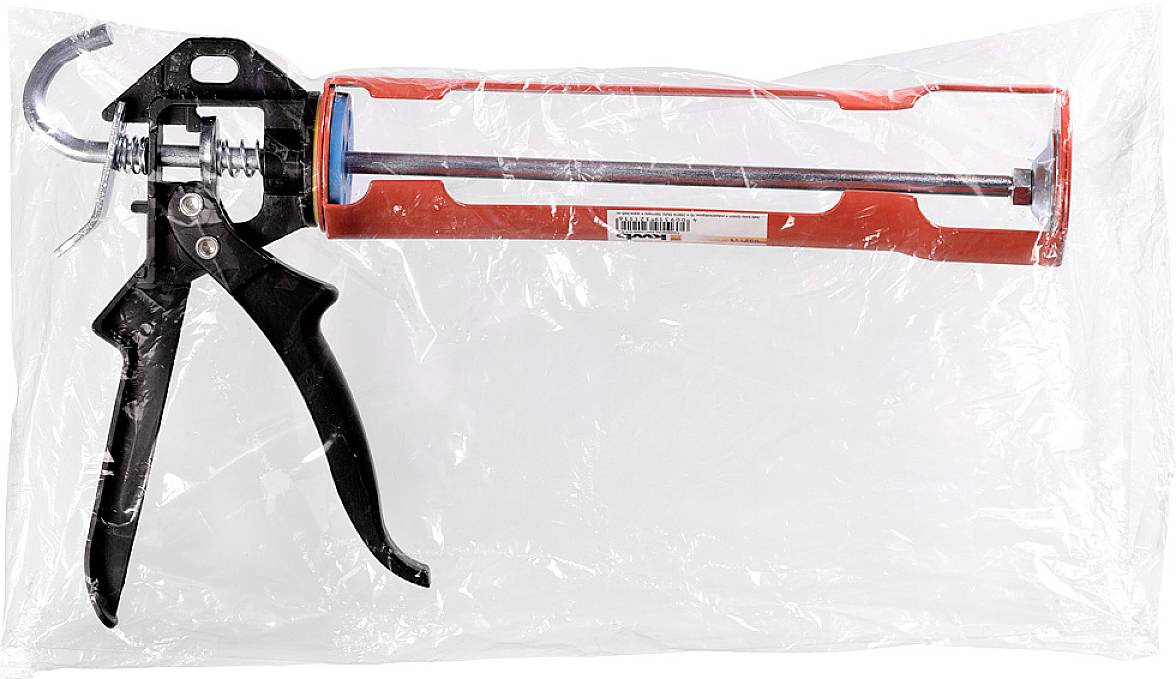 Kartuschenpistole in Plastikverpackung, schwarz-rotes Design, dient zum Auftragen von Dichtungsmaterialien.