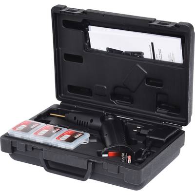 Ein schwarzer Werkzeugkoffer mit einem elektrischen Gerät und mehreren Zubehörteilen sowie Bedienungsanleitungen.