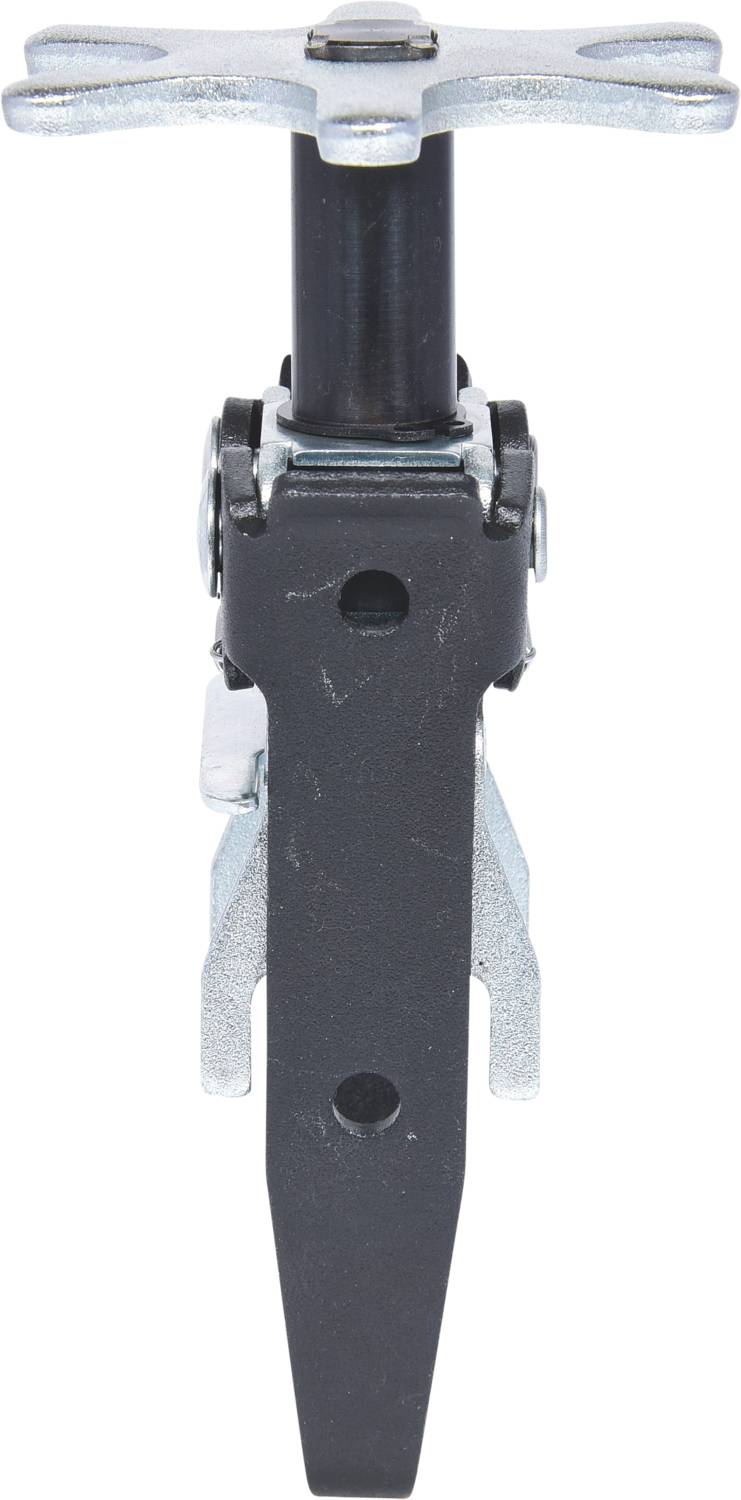 Ein schwarzer Spanngurtspanner mit silbernen Metallteilen. Verwendet zum Festziehen von Zurrgurten, um Ladung zu sichern.