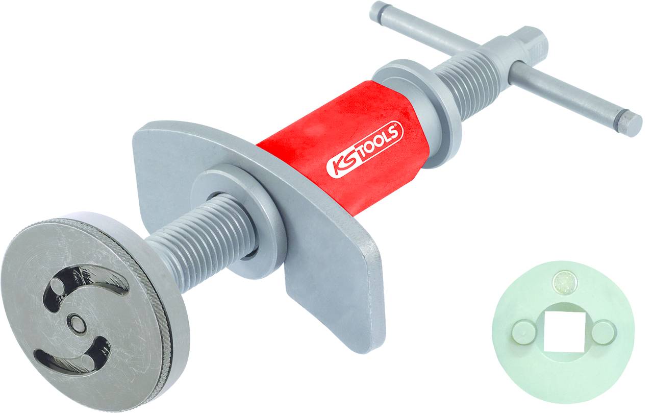 Ein Bremssattelrücksteller mit rotem Griff und Metallteilen, begleitet von einem quadratischen Adapter. Geeignet für Bremswartungsarbeiten.